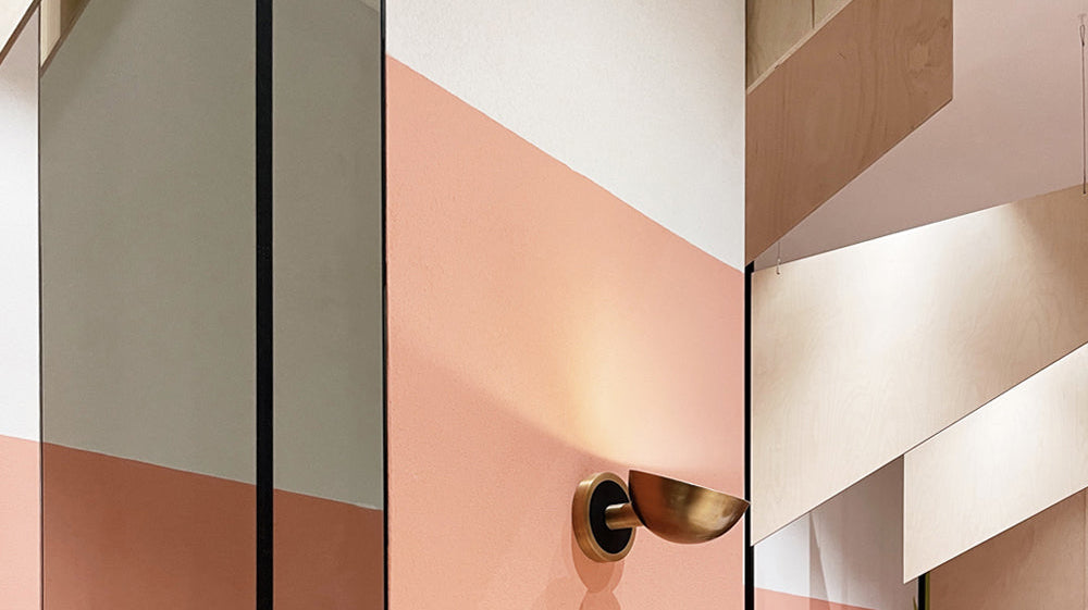 Inside a store with ambient lighting on wall and peach accents