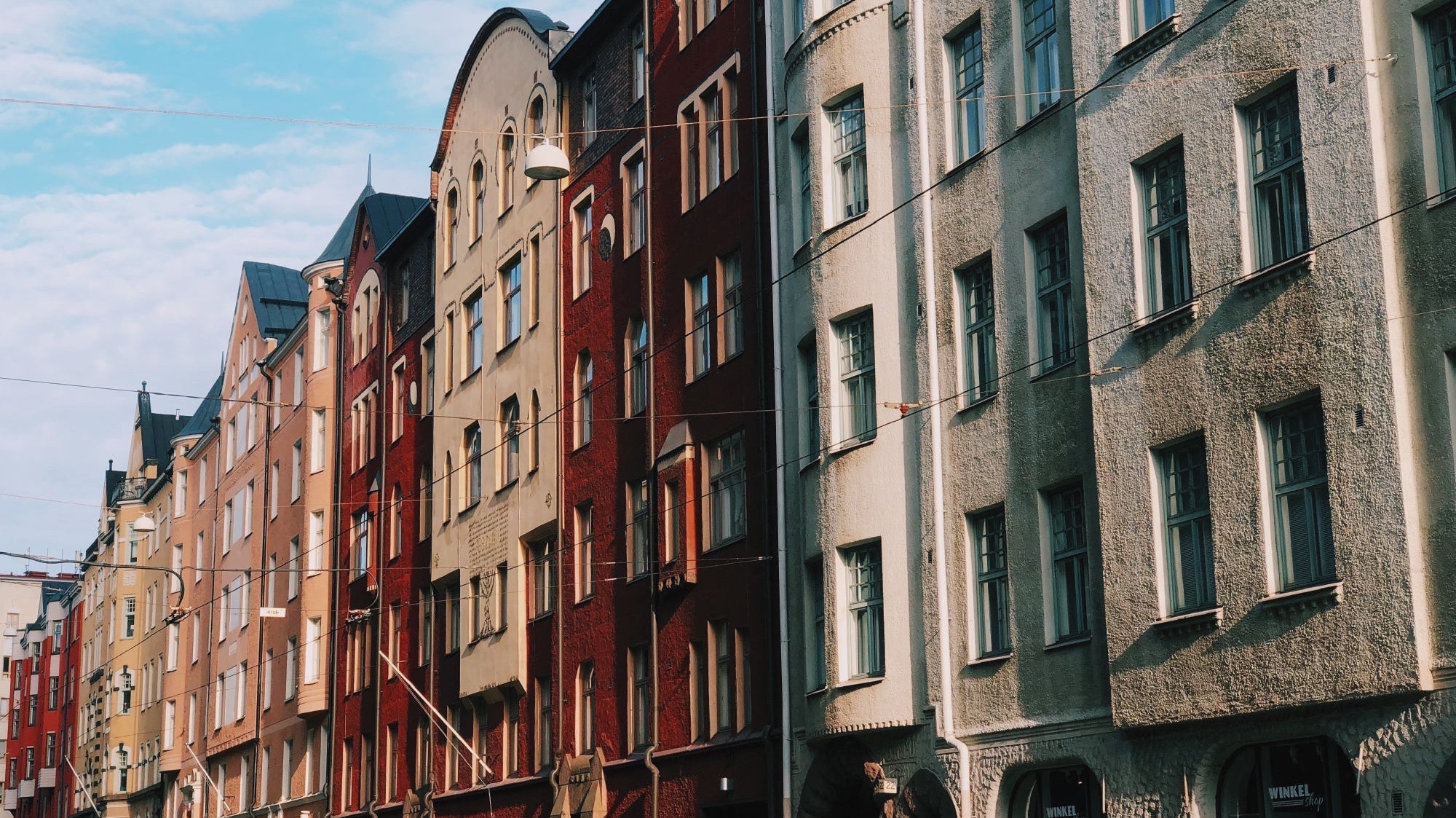 Helsinki street with colourful buildings in a row