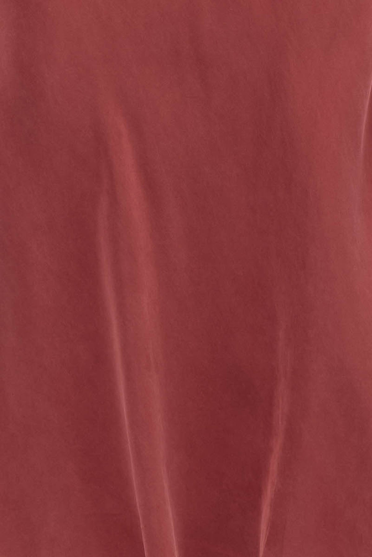 Woman wearing a red long sleeve midi dress