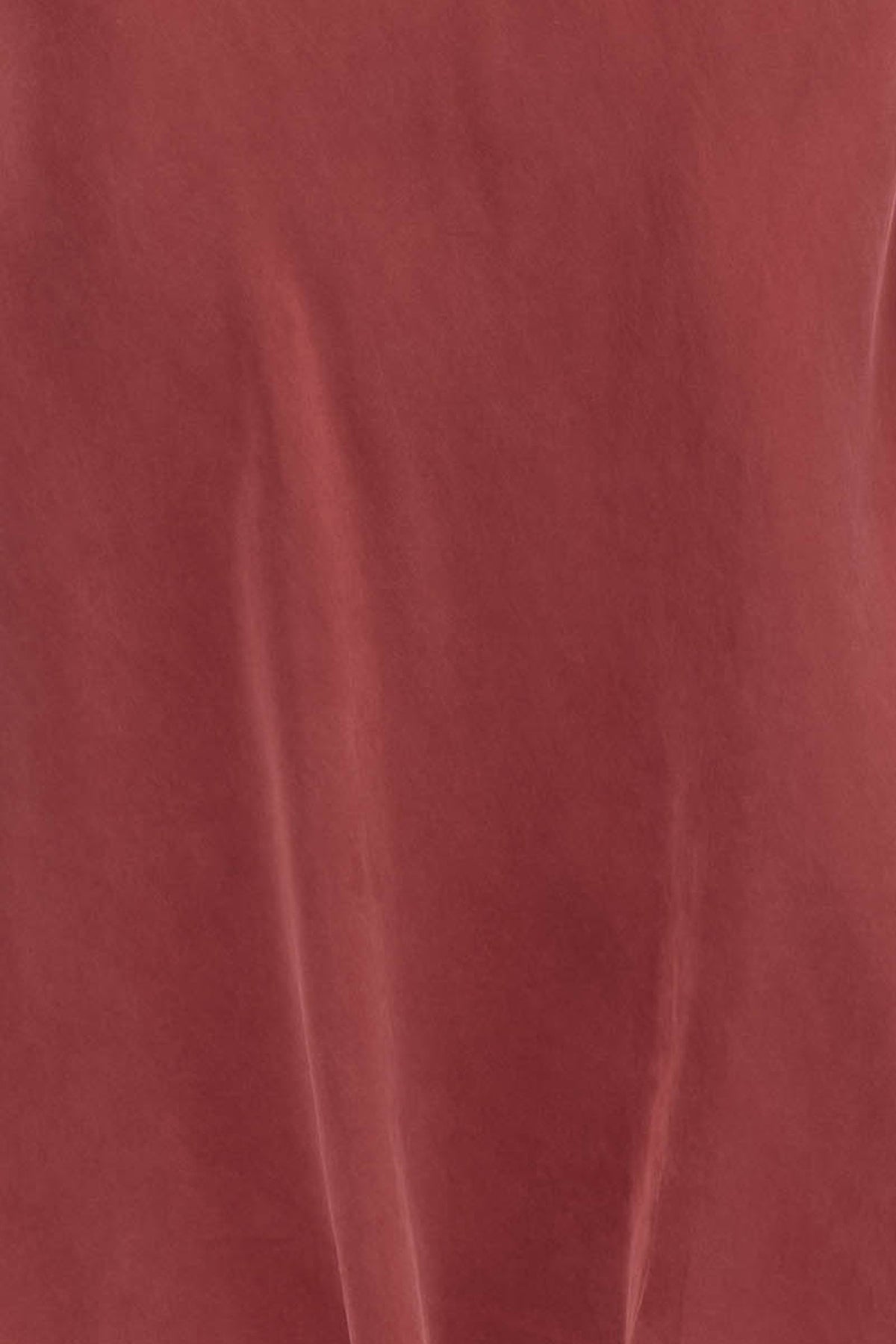 Woman wearing a red long sleeve midi dress
