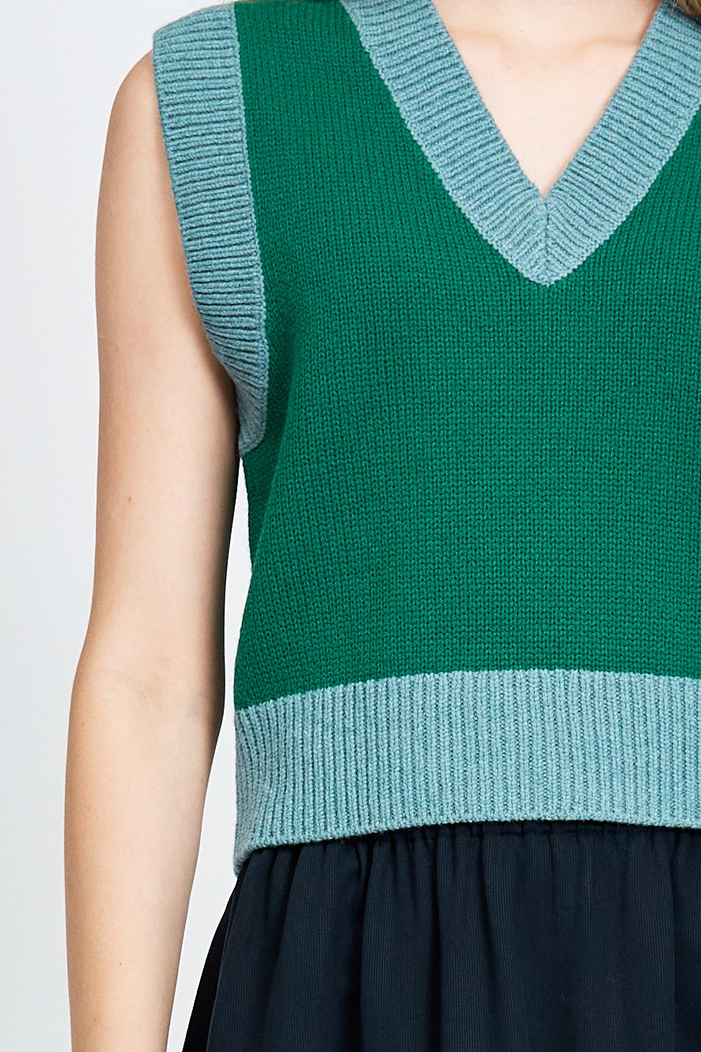 Woman wearing green vest