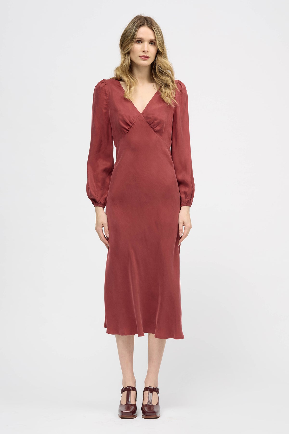 Woman wearing a red long sleeve midi dress