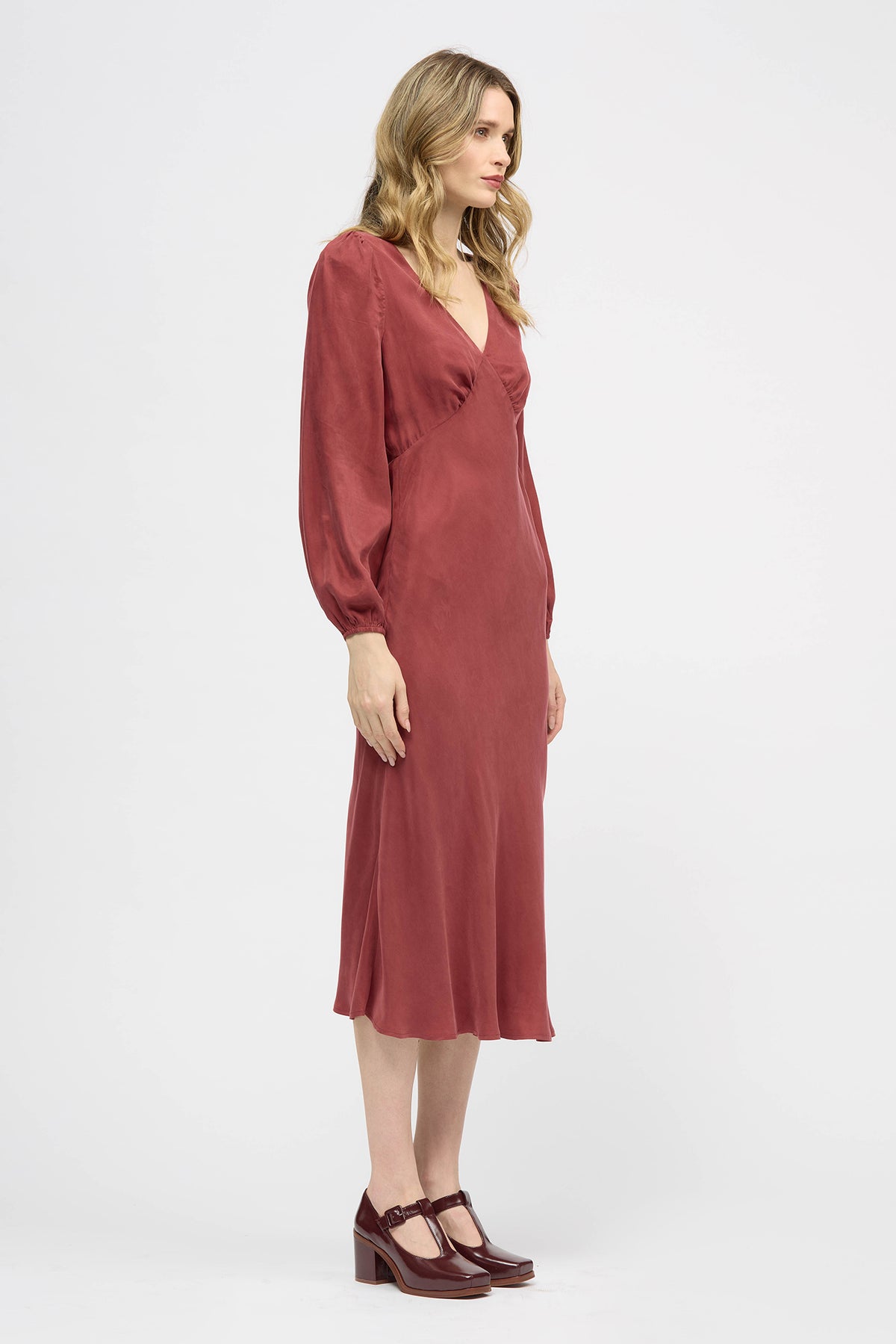 Woman wearing a red long sleeve midi dress