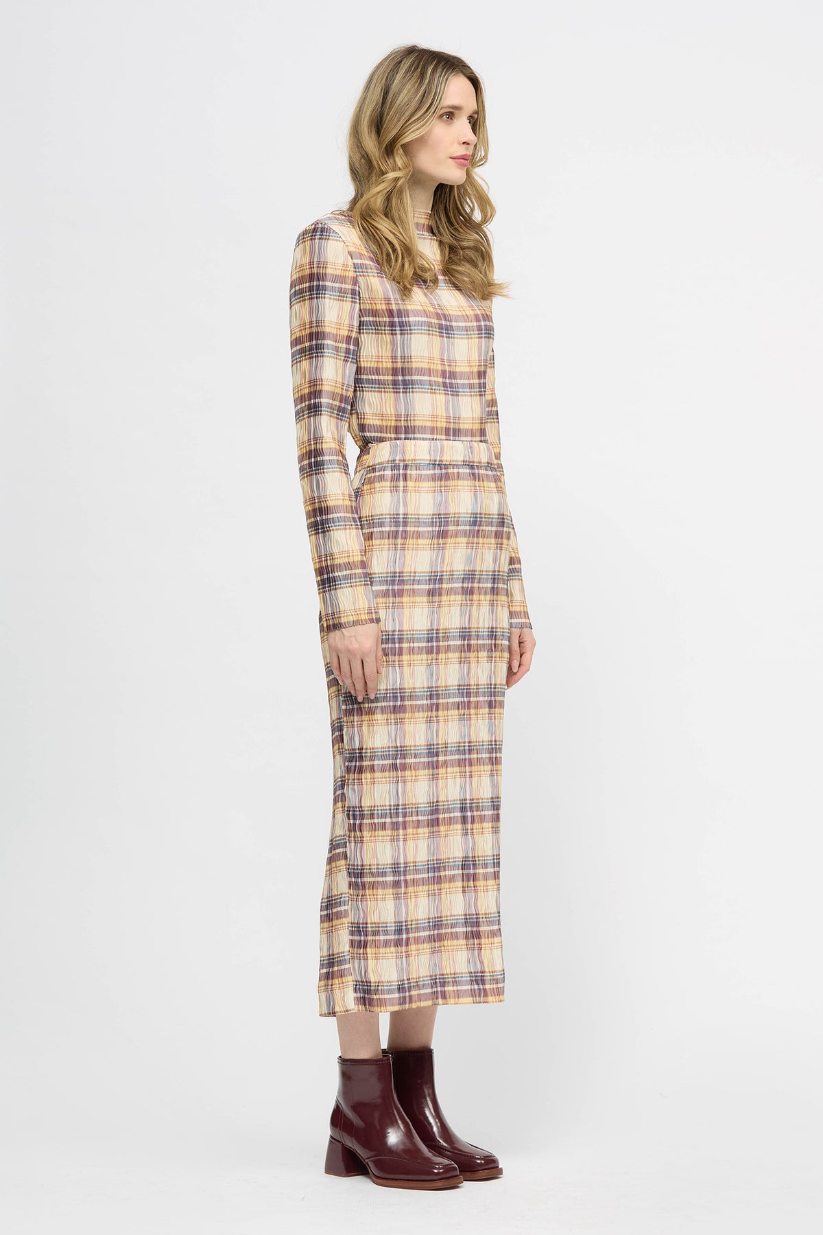 Woman wearing a yellow check lightweight long sleeve top