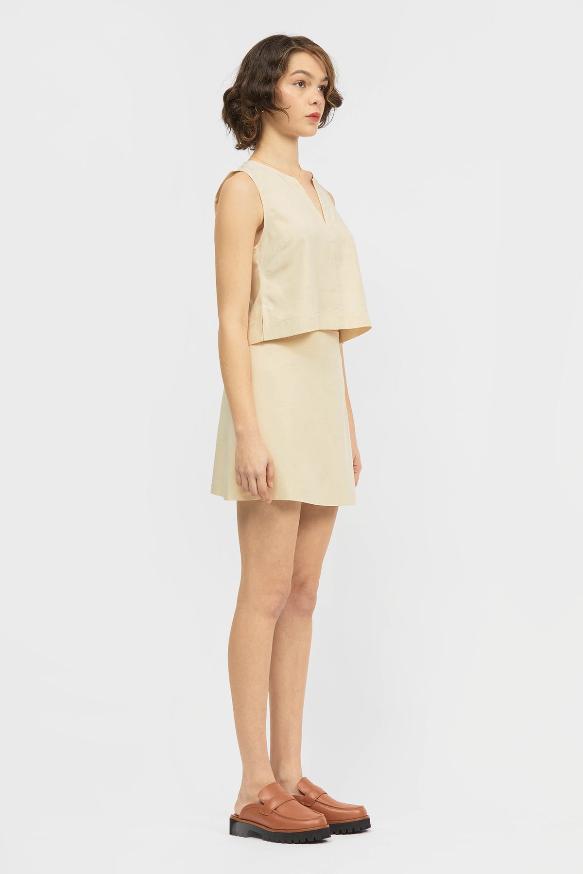 Woman wearing skirt in cream colour