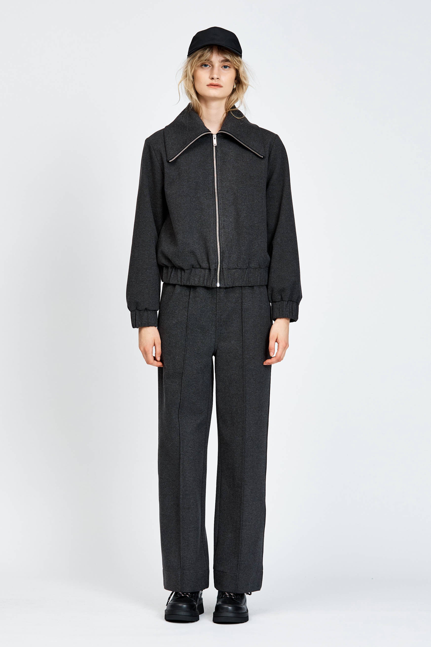 Model wearing relaxed silhouette charcoal pant