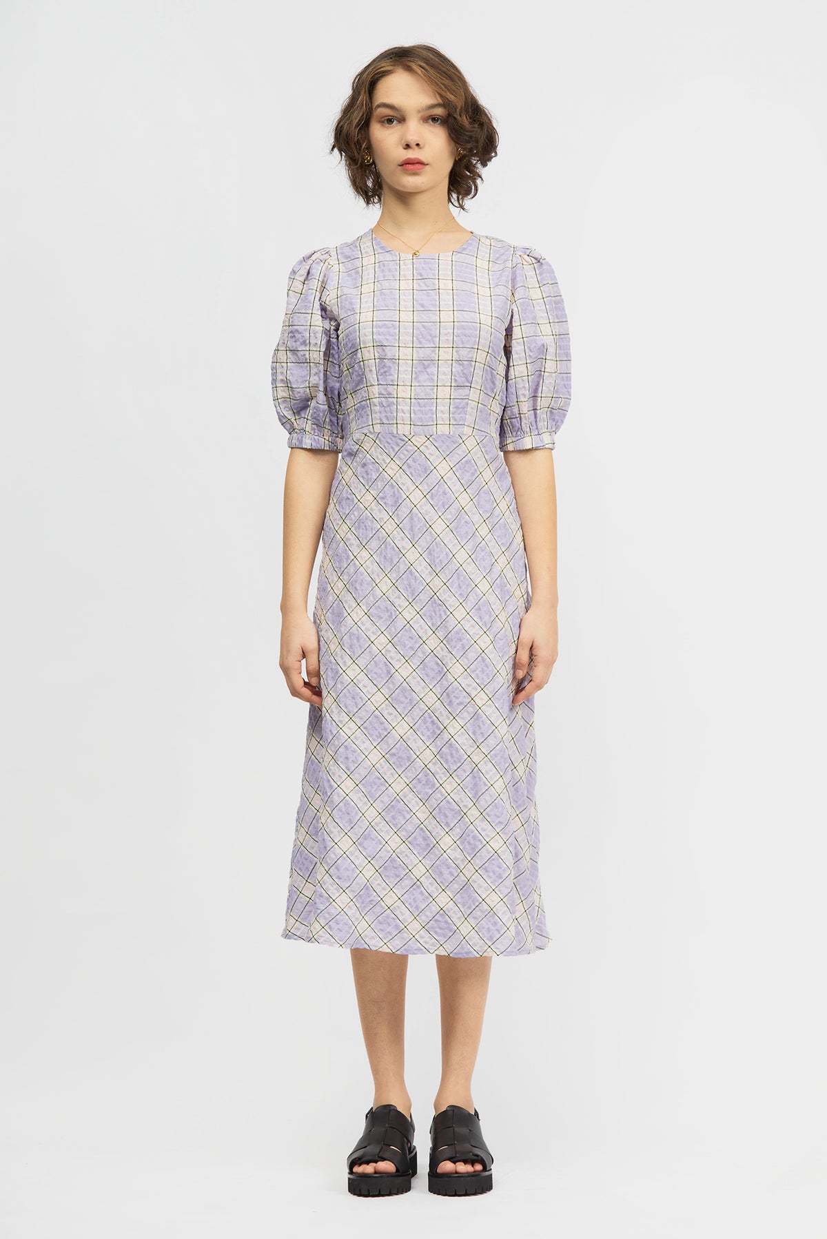 Woman wearing lilac dress