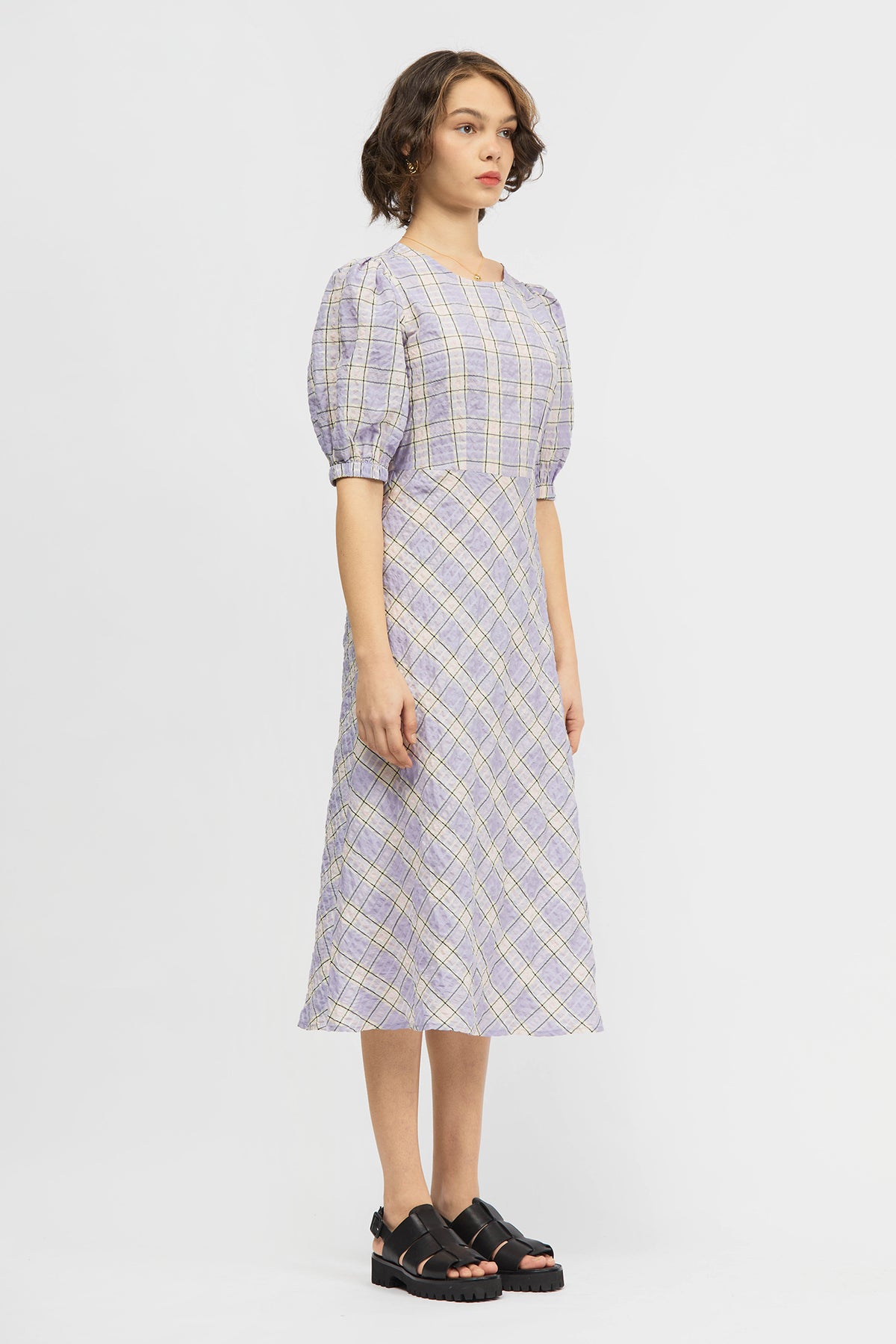 Woman wearing lilac dress
