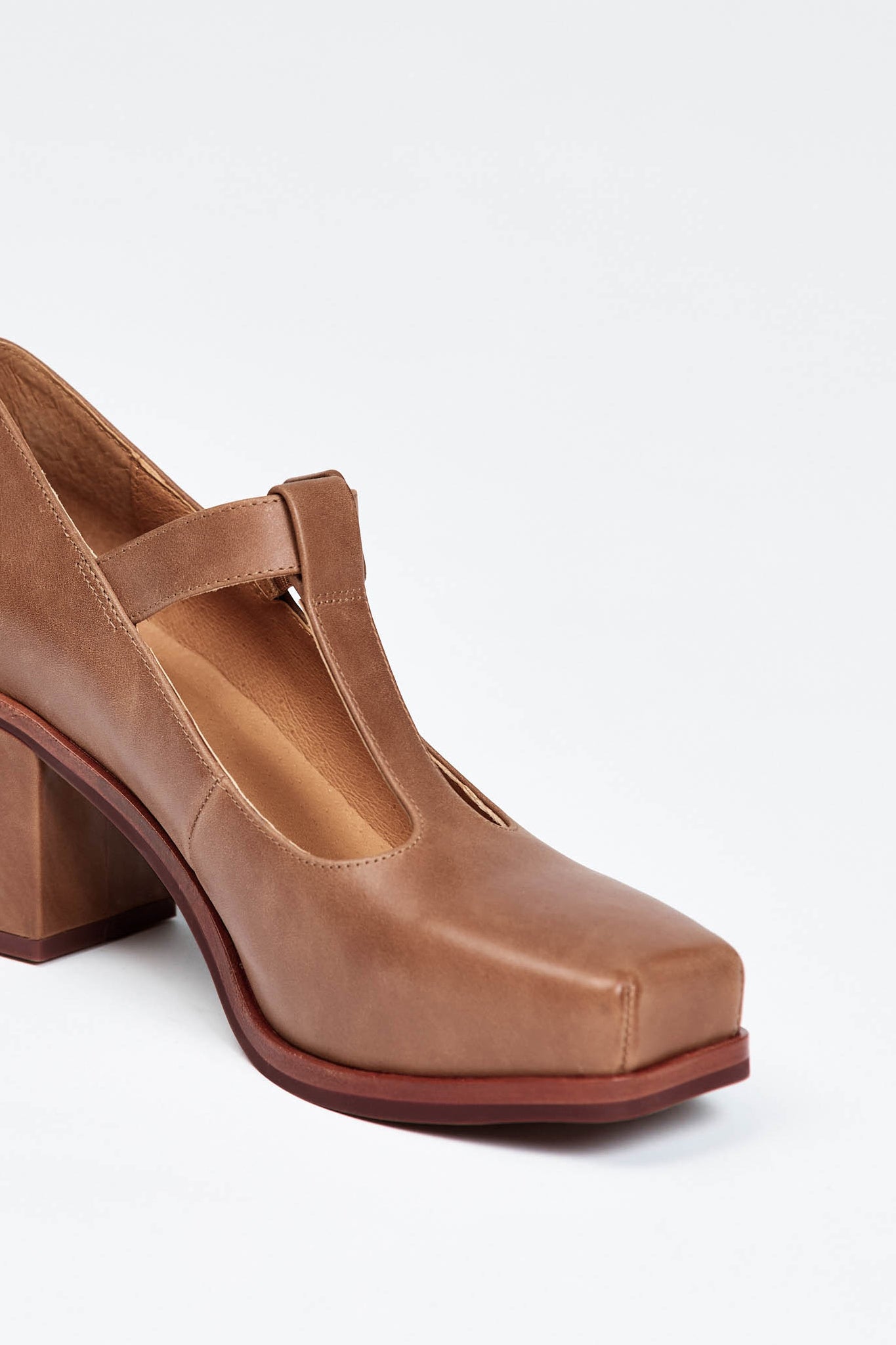 Brown block heel with buckle enclosure