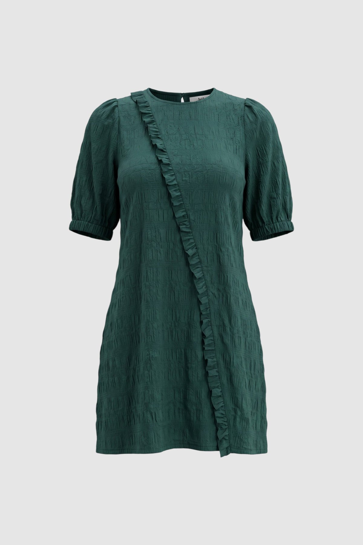 Green mini dress with ruffle detailing on grey background