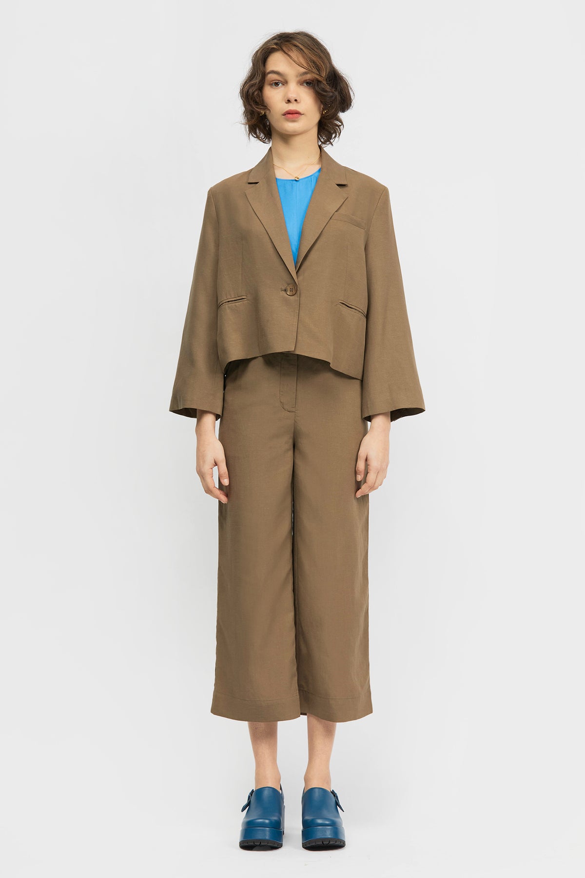 Woman wearing brown blazer