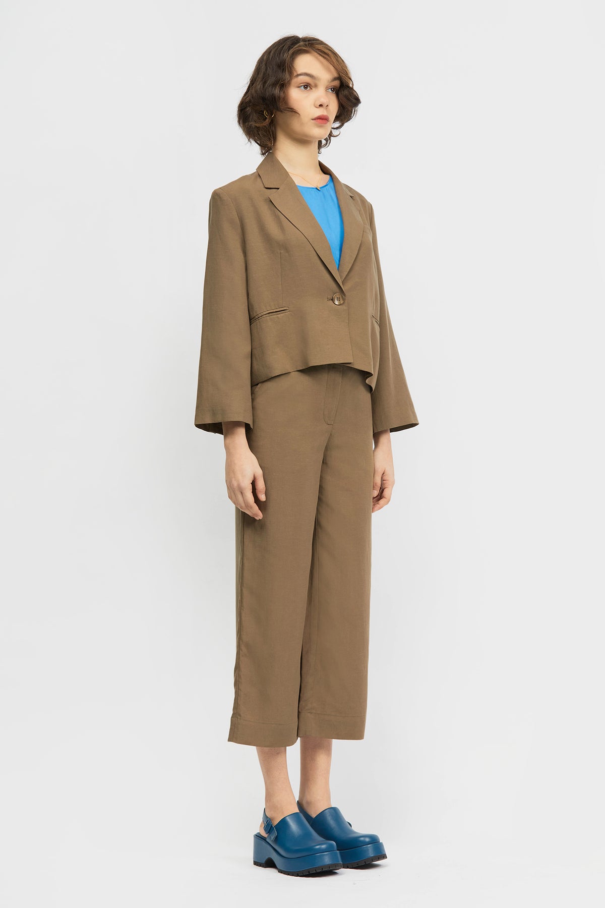 Woman wearing brown blazer
