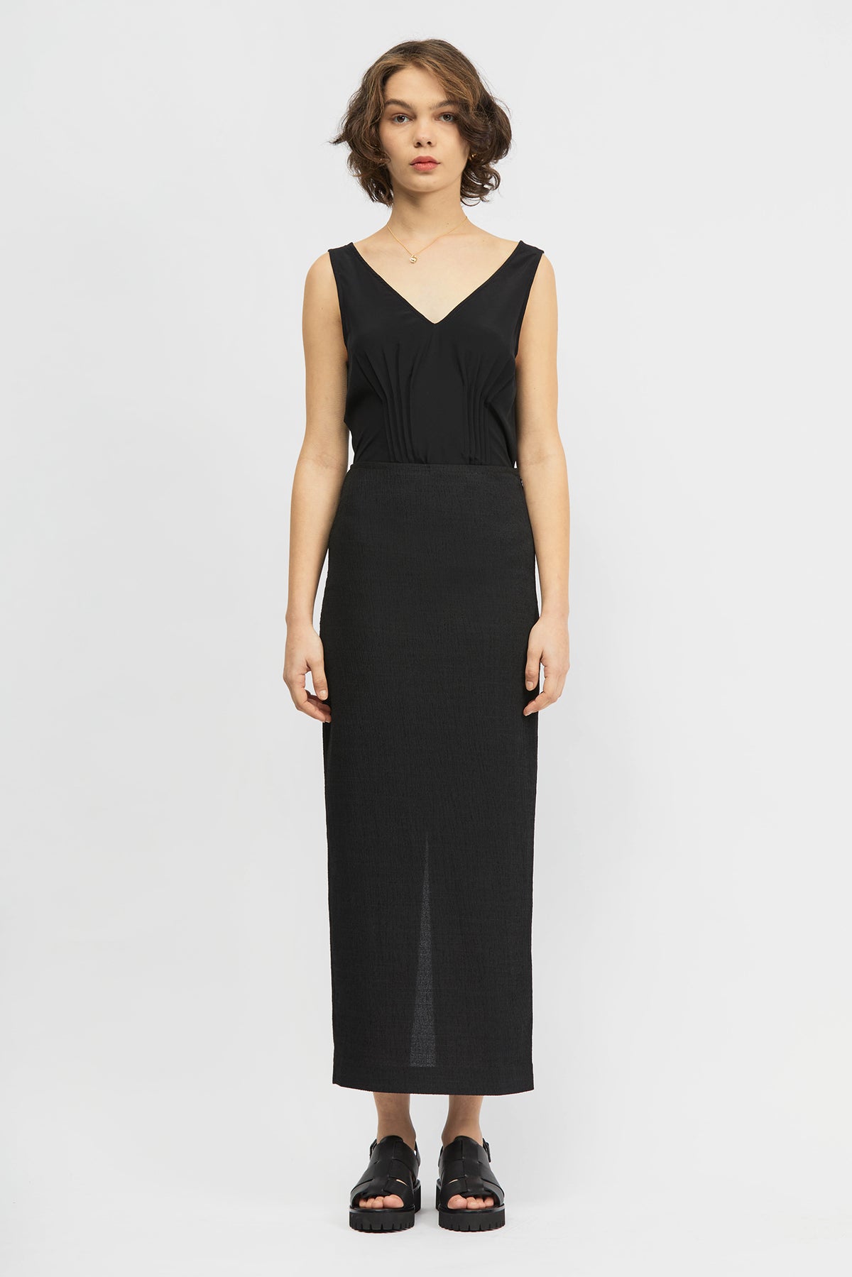 Woman wearing black long skirt