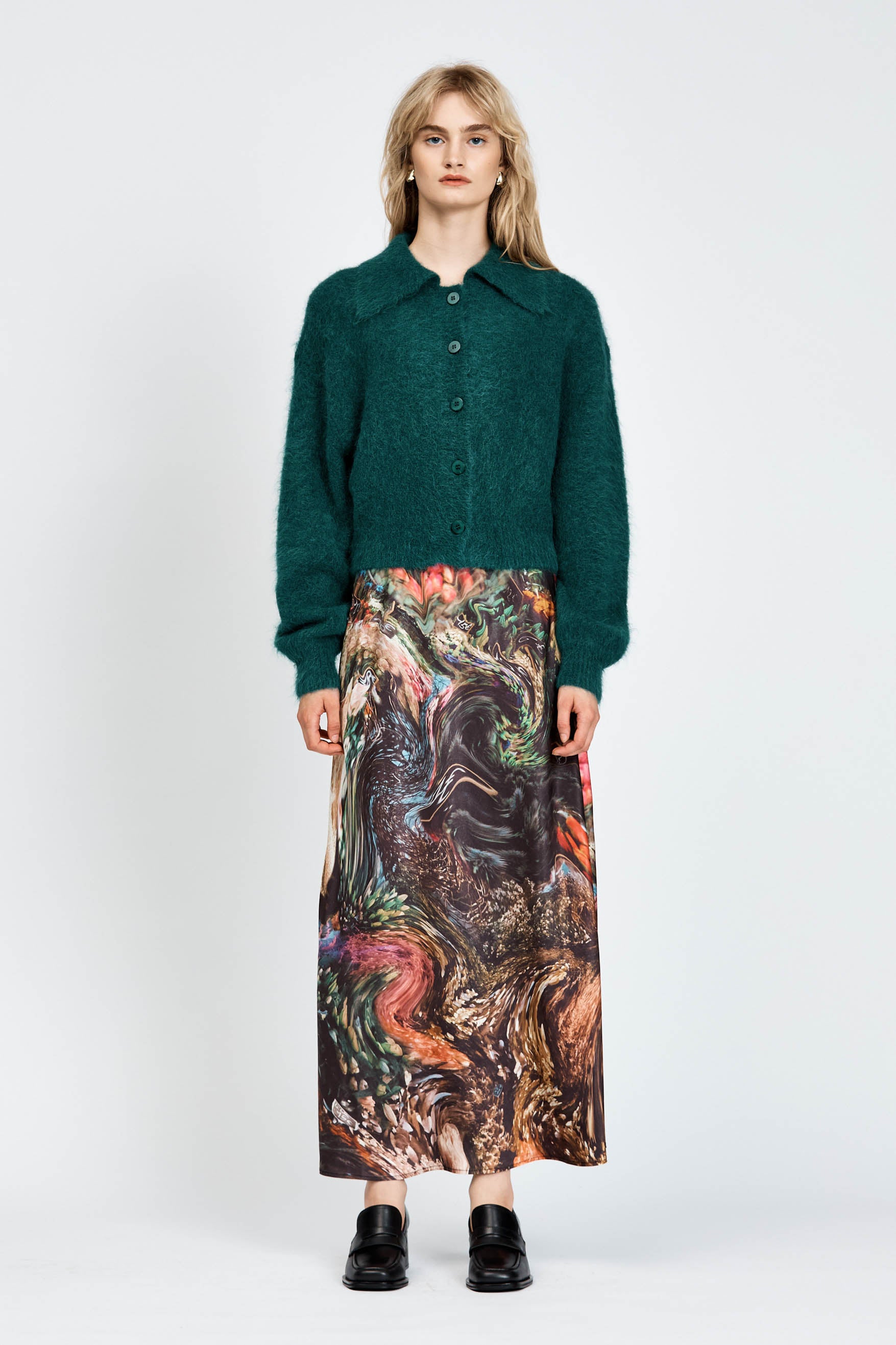 Woman wearing a fluffy green cardigan