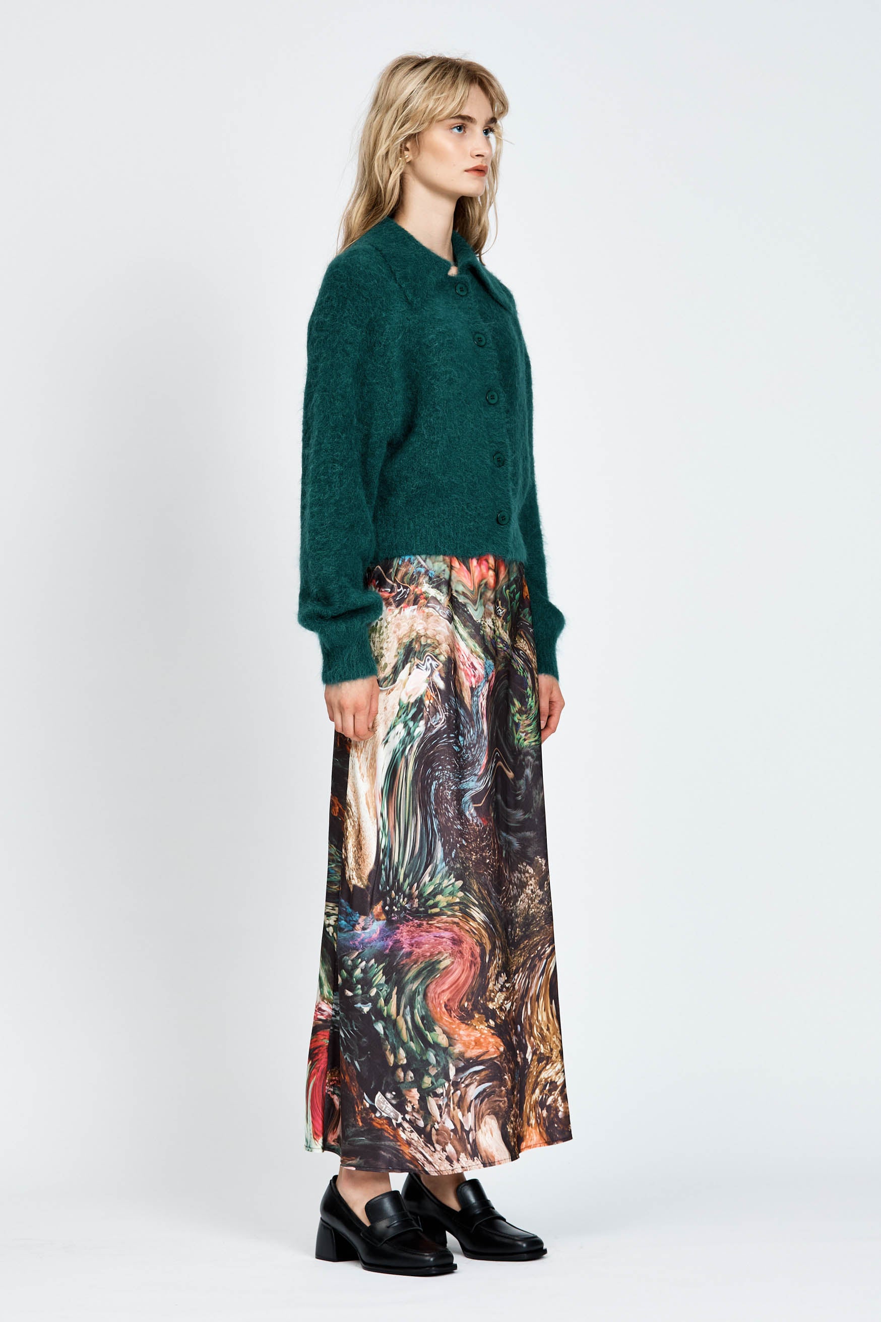 Woman wearing a fluffy green cardigan