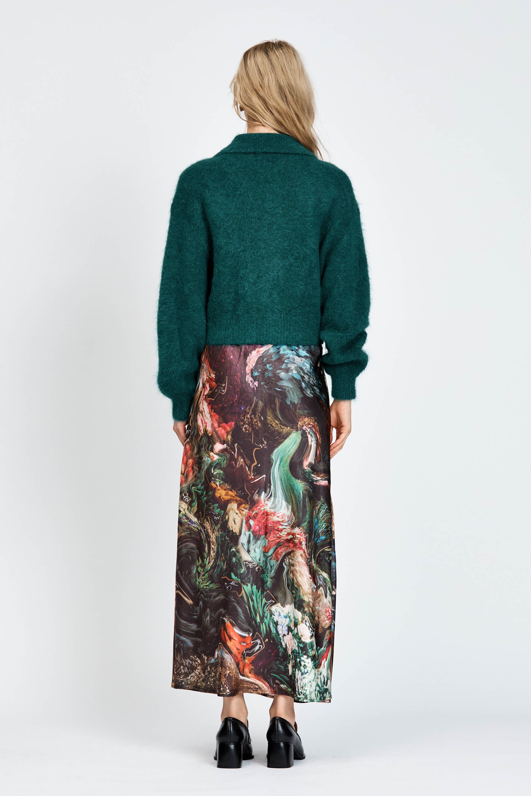 Woman wearing a fluffy green cardigan