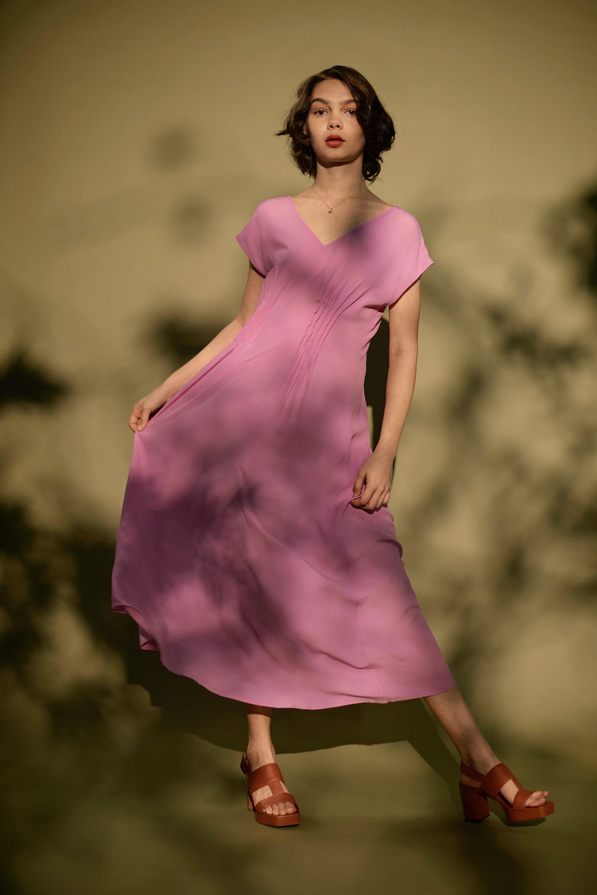Woman wearing sleeveless pink dress
