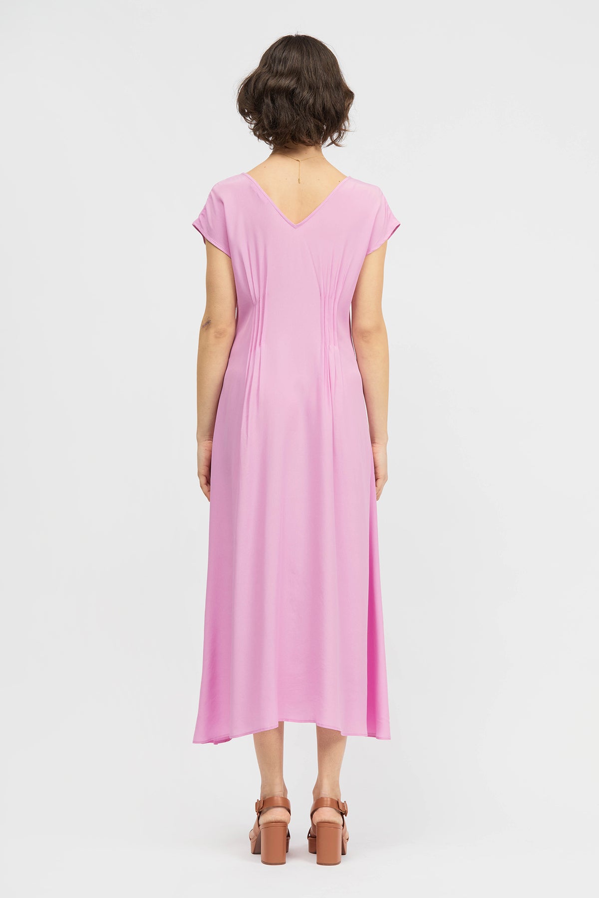 Woman wearing sleeveless pink dress
