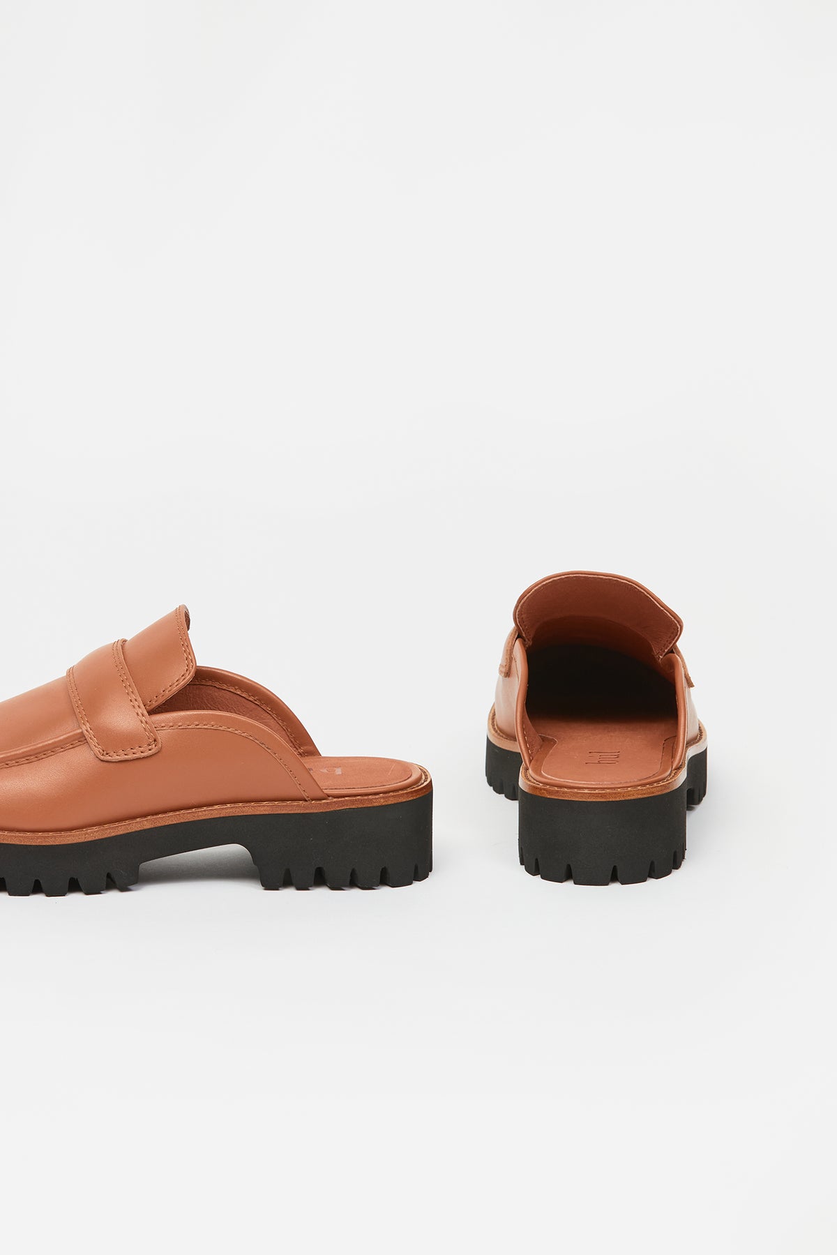 Brown womans loafer with black sole
