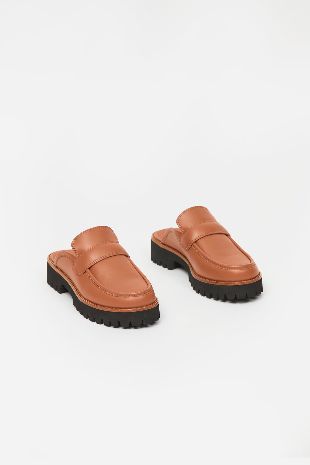 Brown womans loafer with black sole
