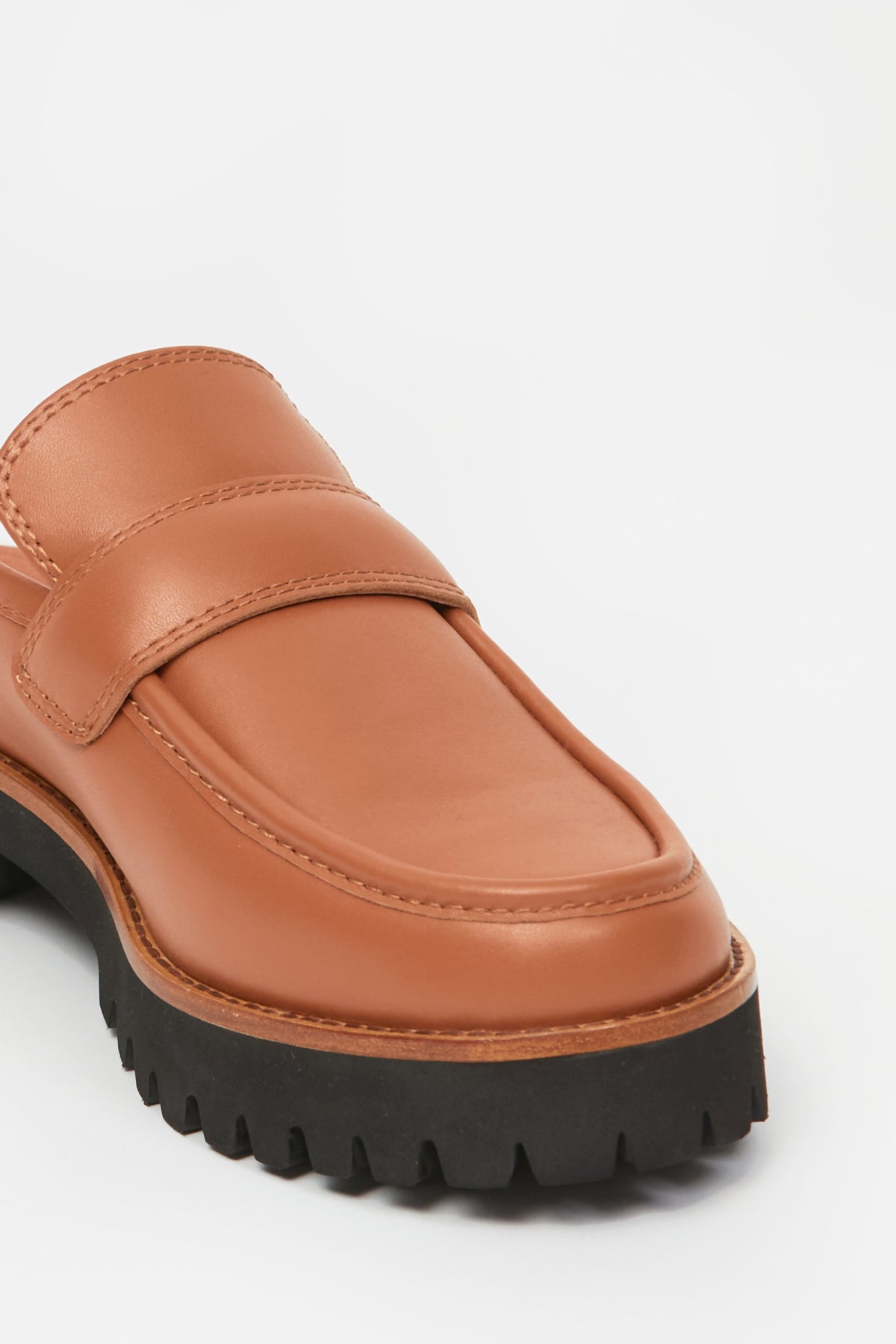Brown womans loafer with black sole