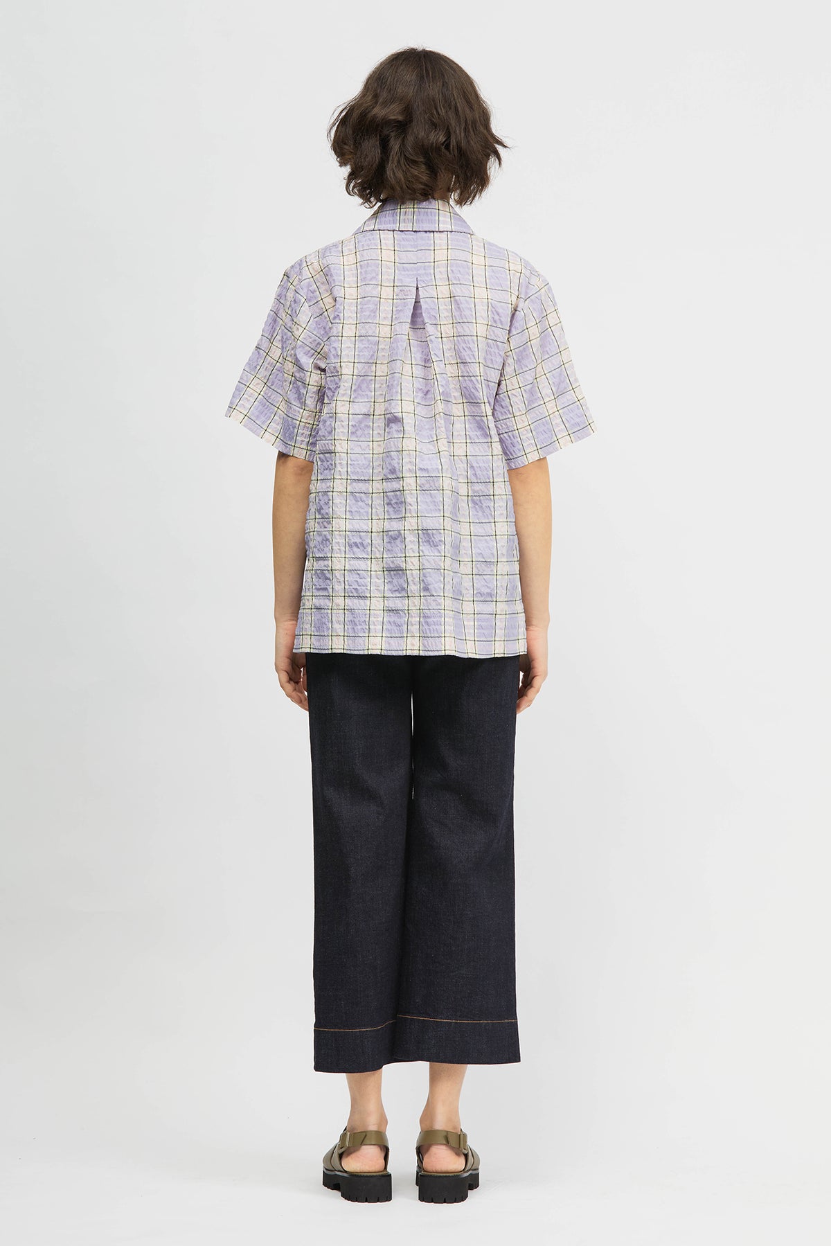 Woman wearing shirt in lilac check