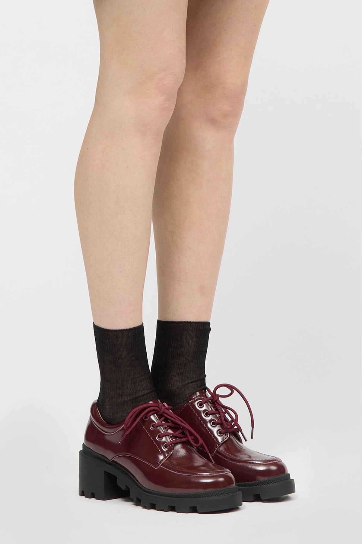 Image of a burgundy brogue shoe
