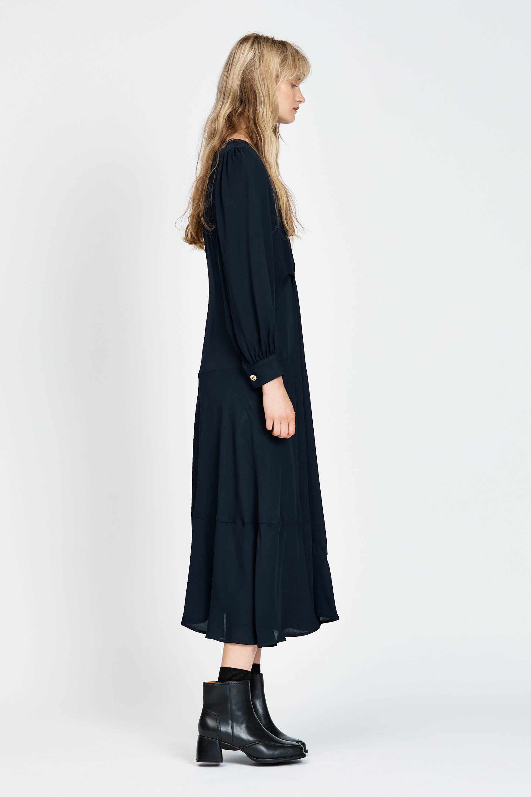Model wearing a navy long sleeve midi dress