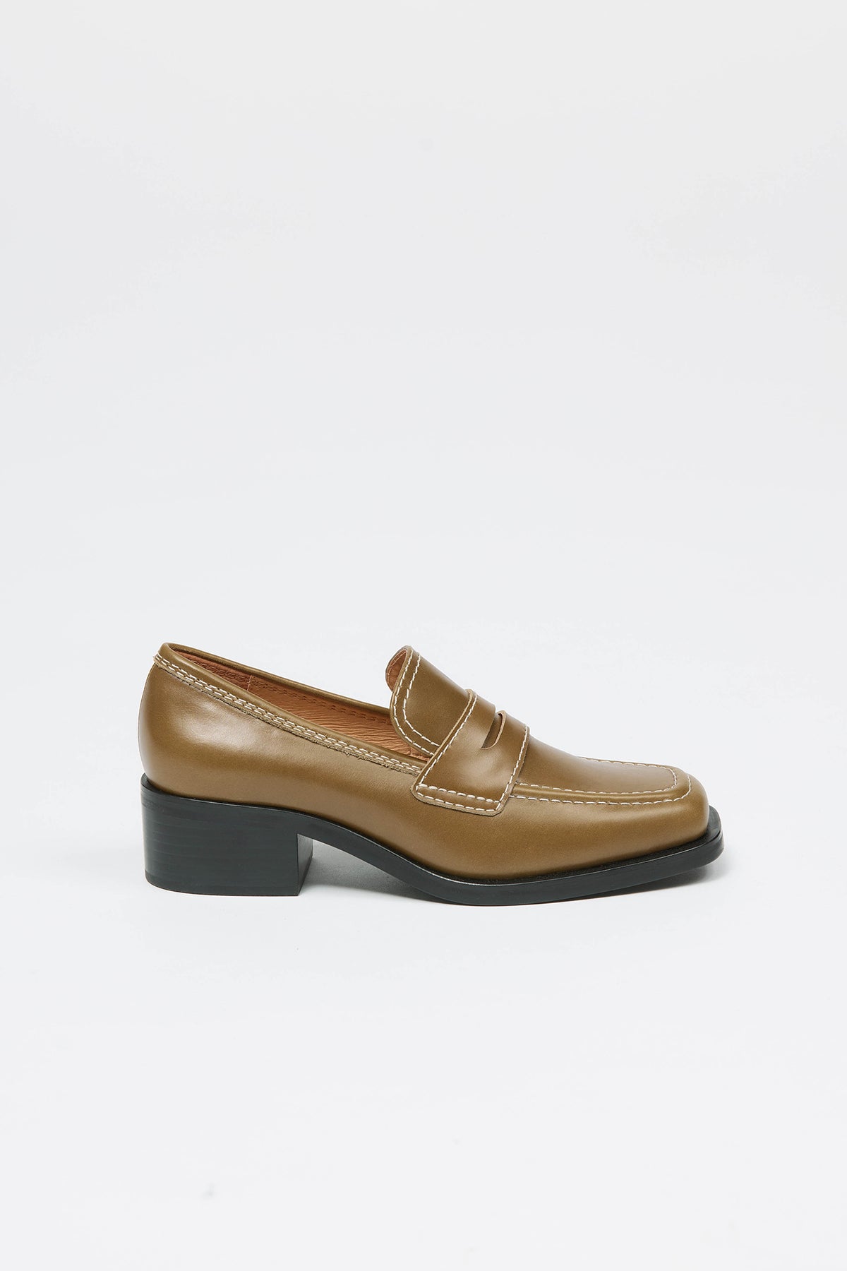 Woman wearing an olive loafer