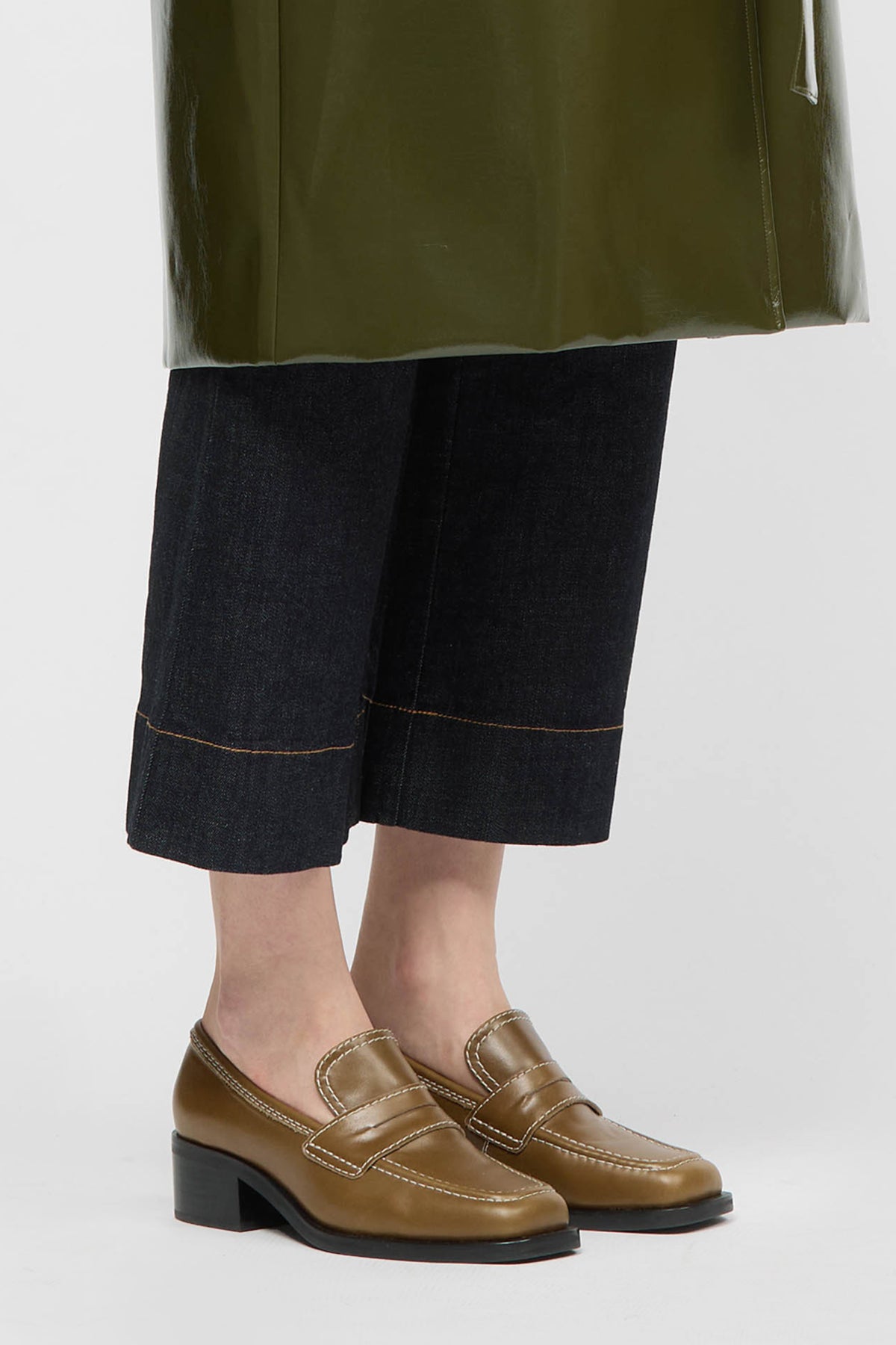 Woman wearing an olive loafer