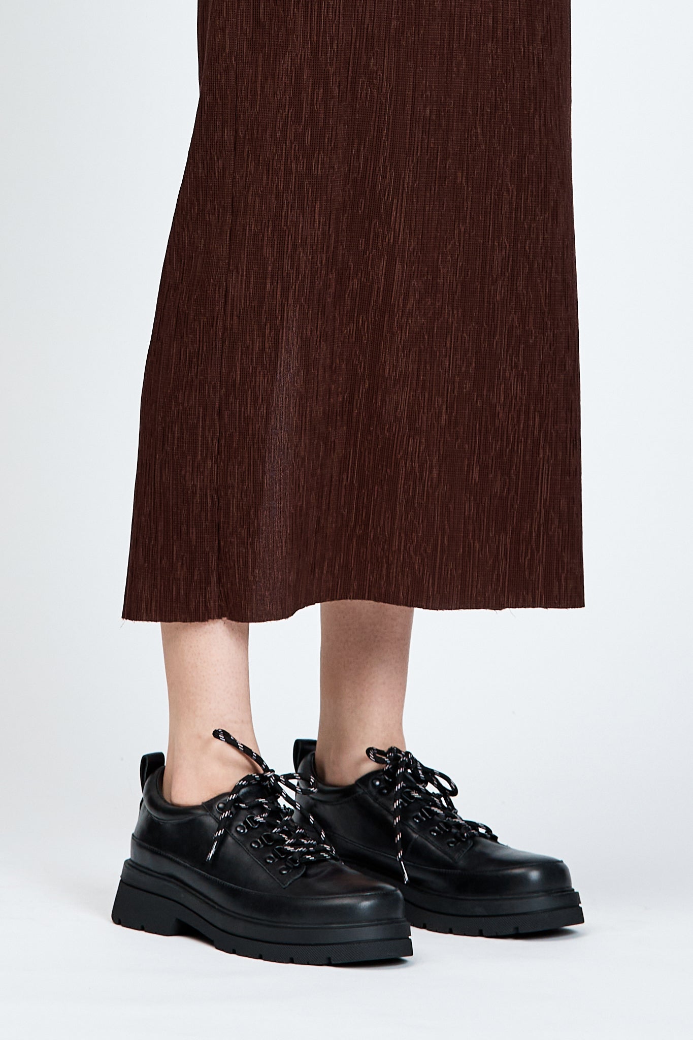 Black shoe with round toe and black and white contrast laces