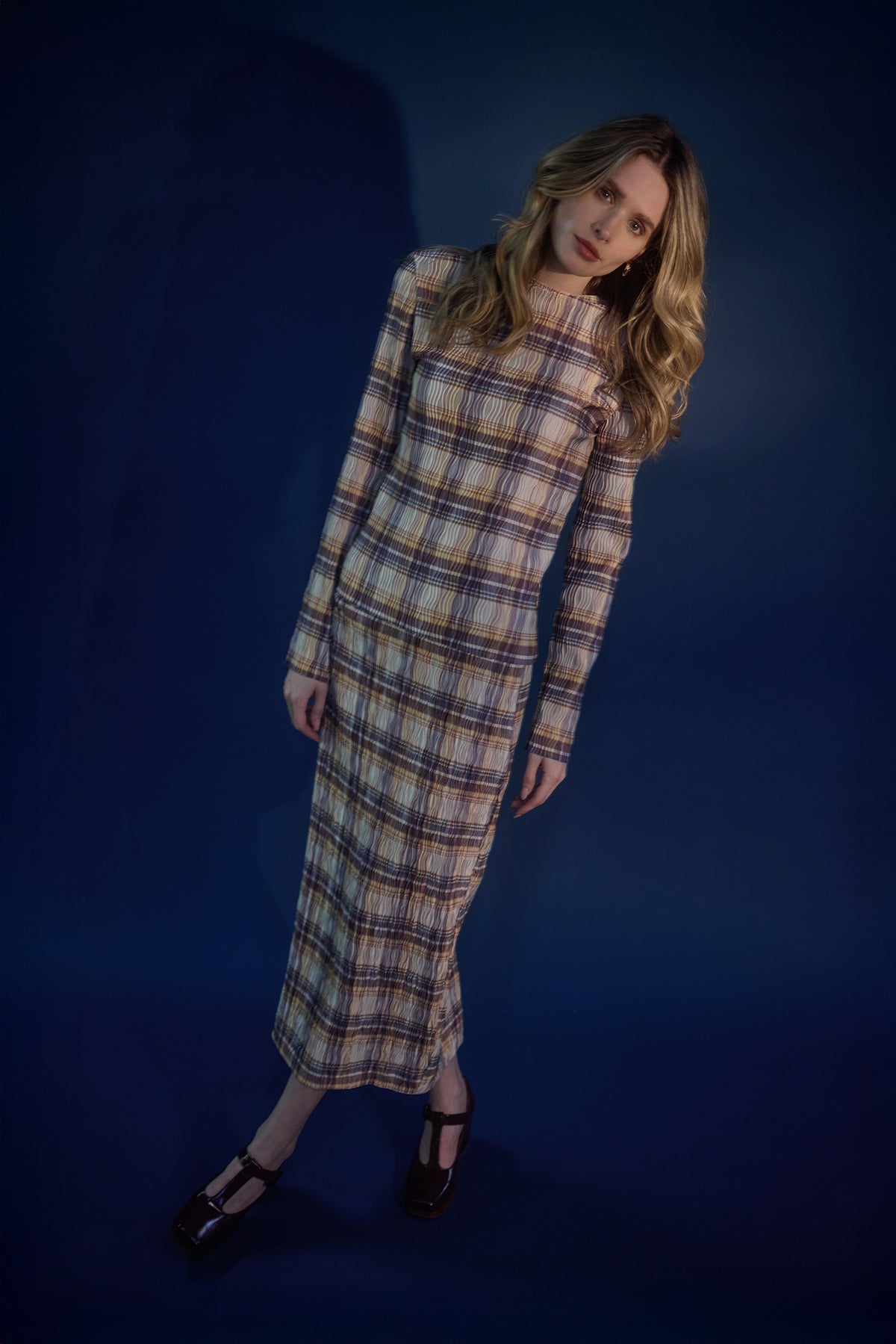 Woman wearing a yellow check lightweight long sleeve top