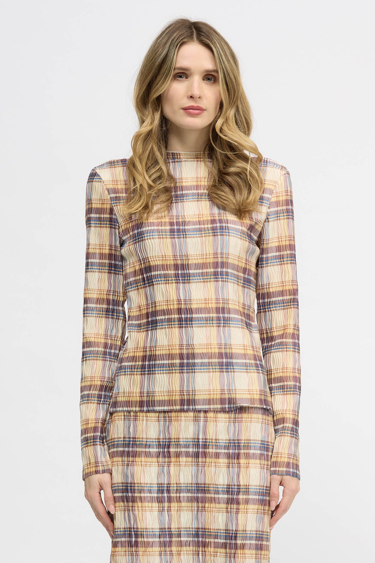 Woman wearing a yellow check lightweight long sleeve top