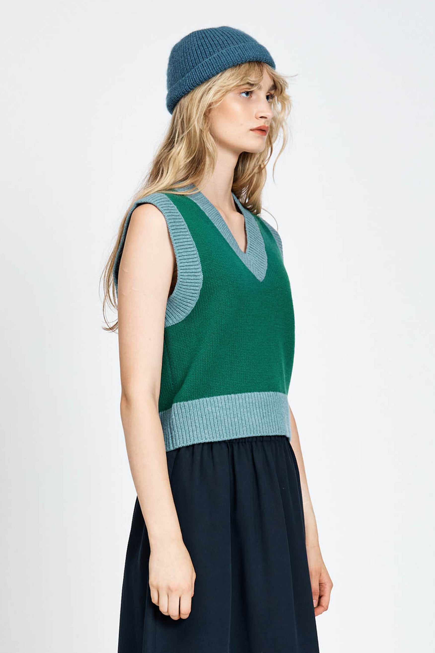 Woman wearing green vest