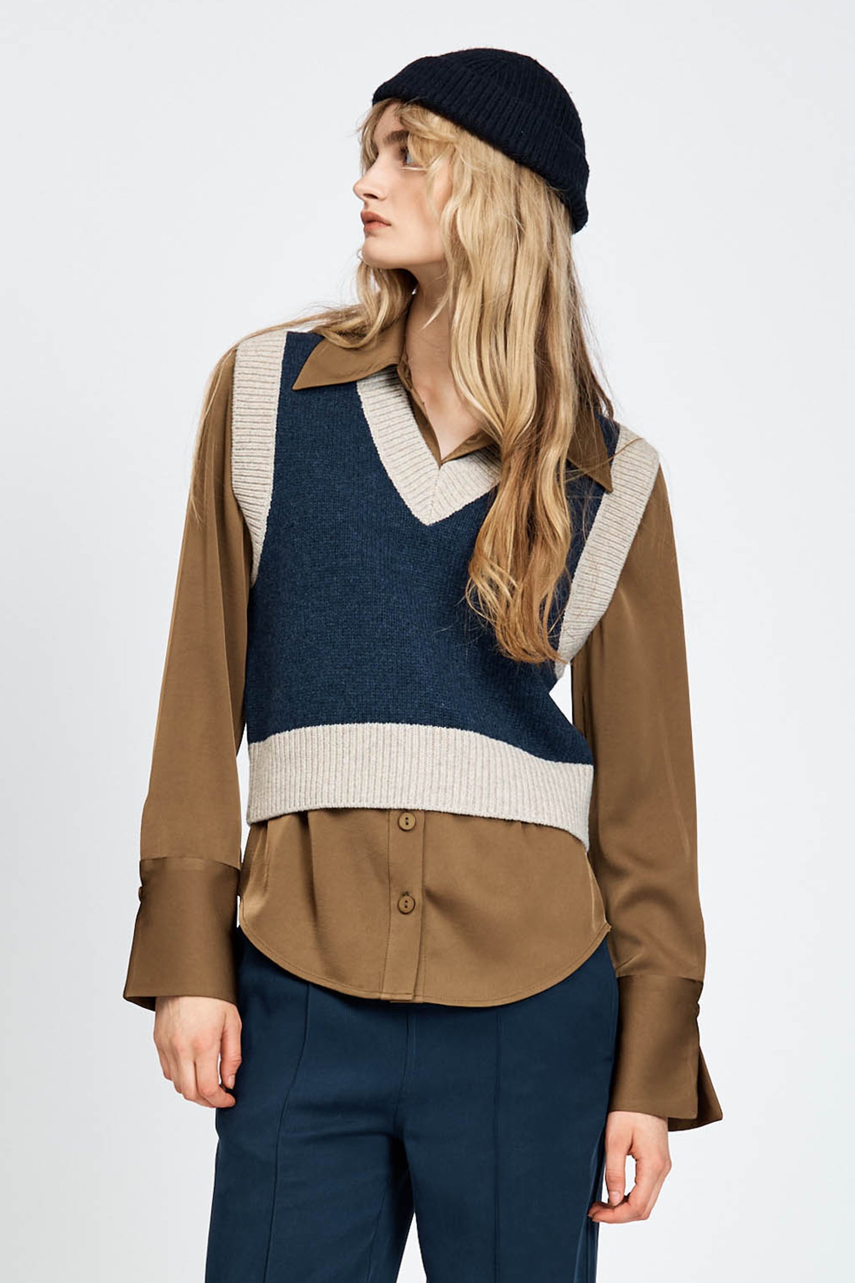 Woman wearing knitted vest in navy