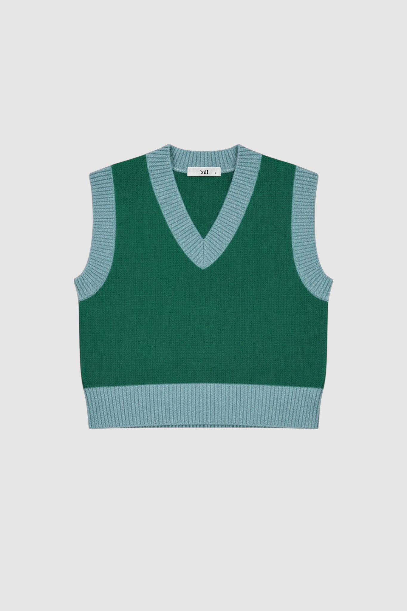 Woman wearing green vest