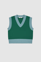 Woman wearing green vest