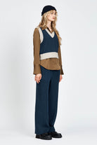 Woman wearing knitted vest in navy