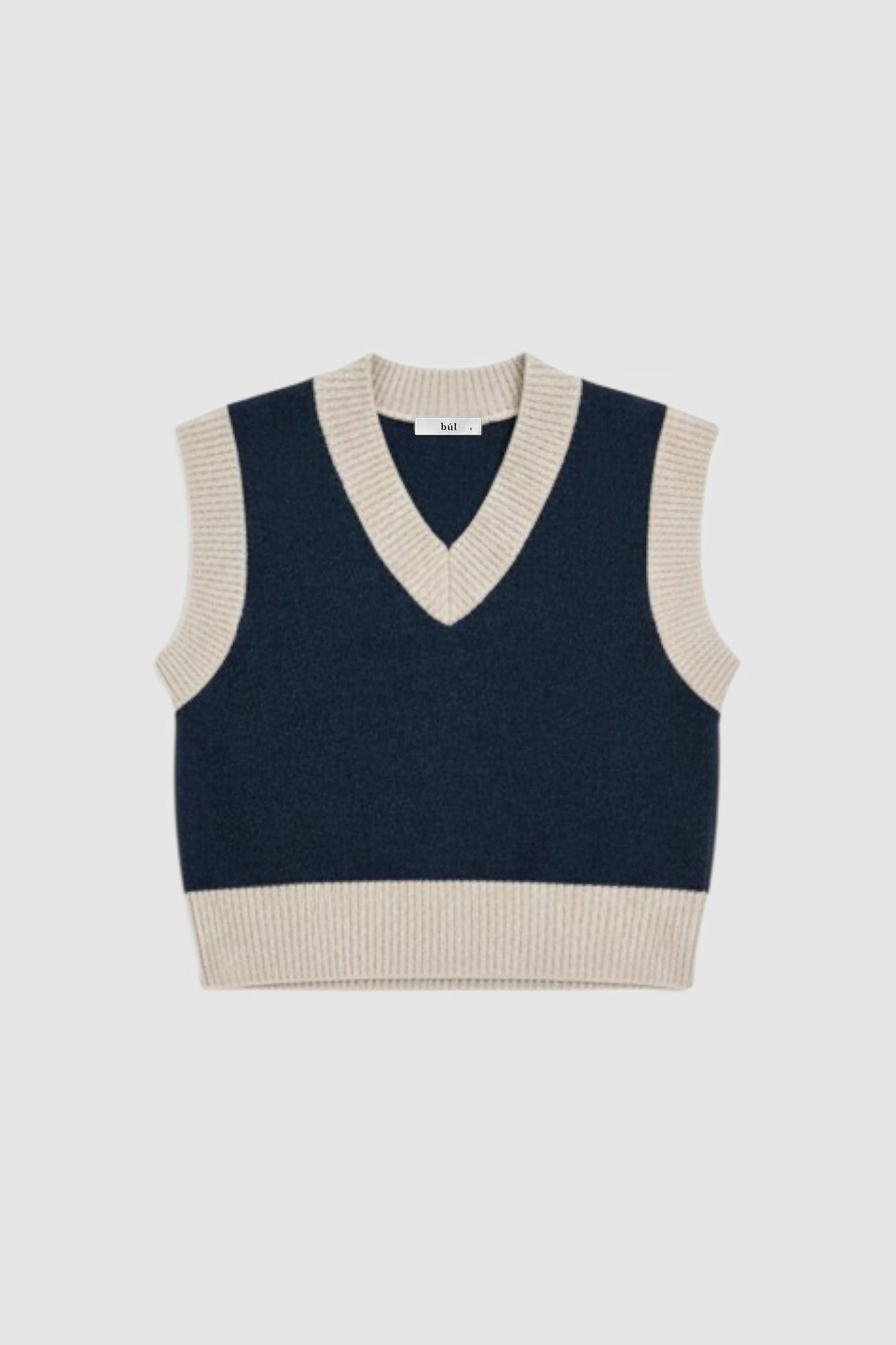 Woman wearing knitted vest in navy