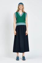 Woman wearing green vest