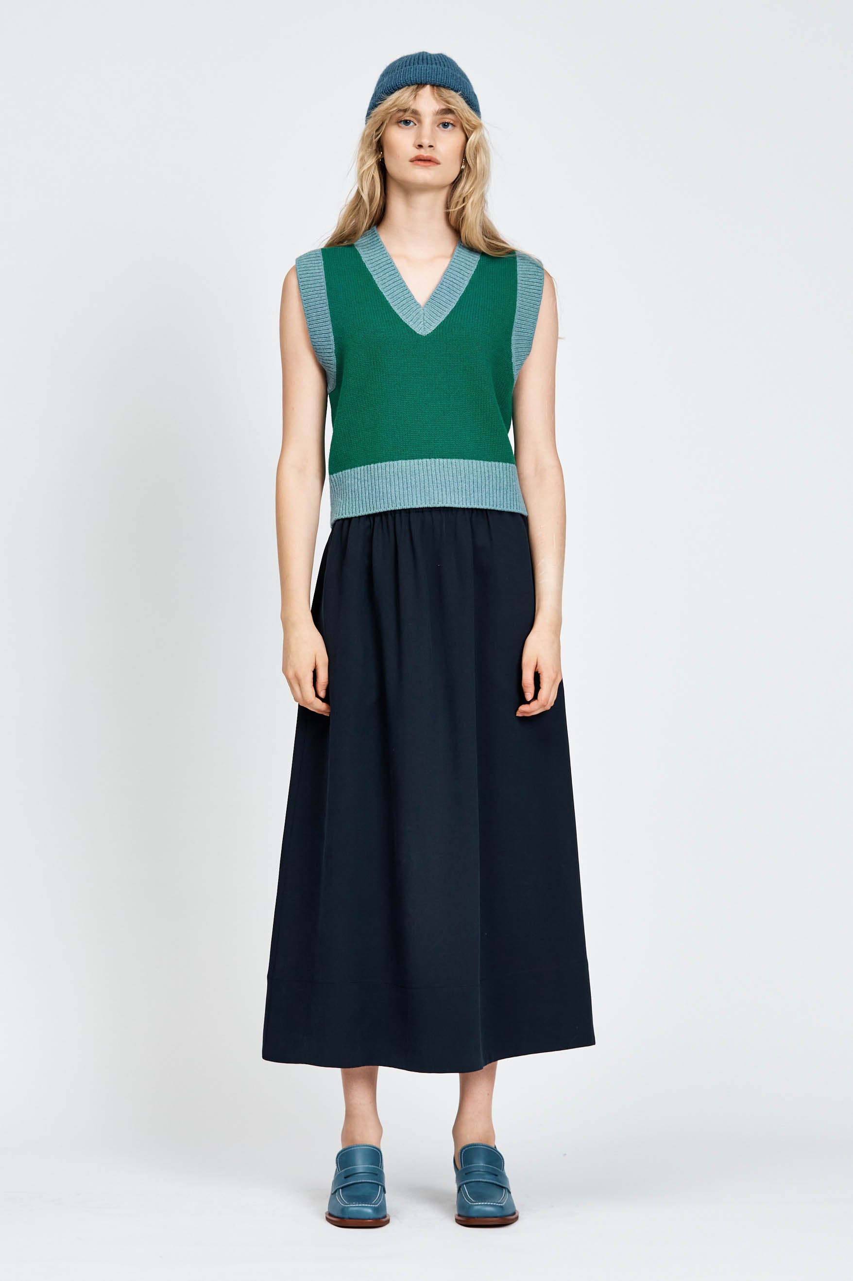 Woman wearing green vest