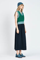 Woman wearing green vest