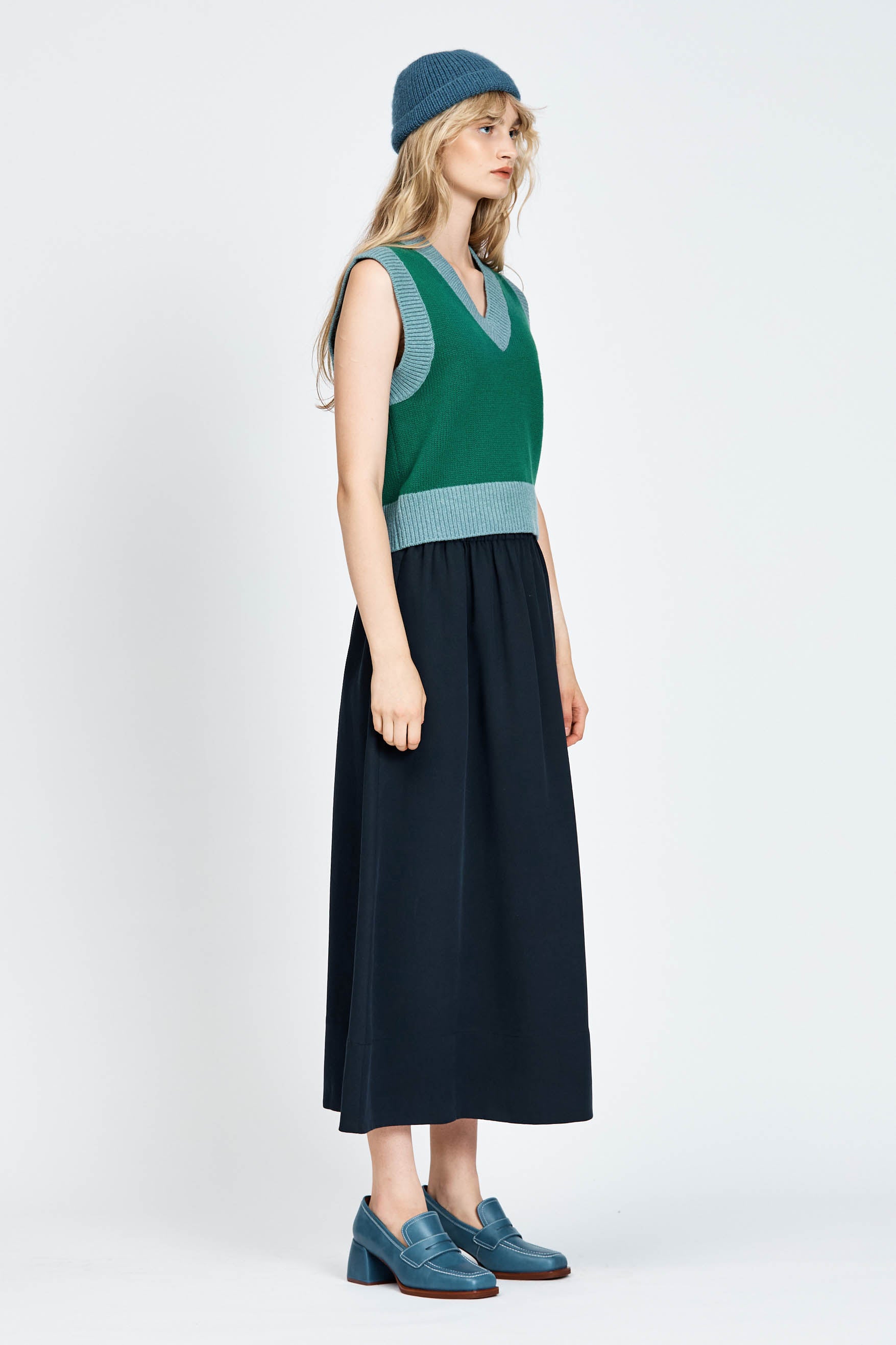 Woman wearing green vest
