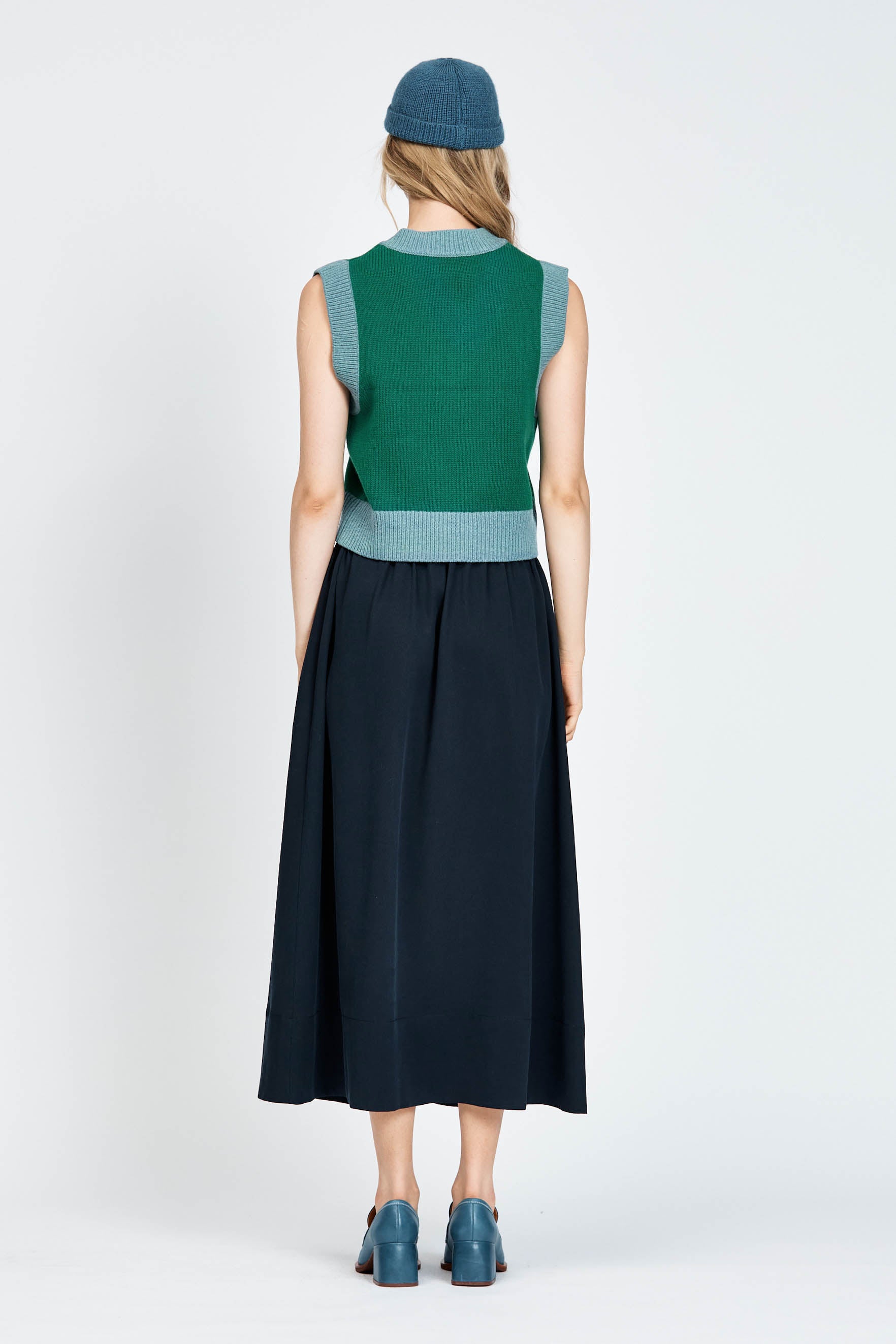 Woman wearing long navy skirt