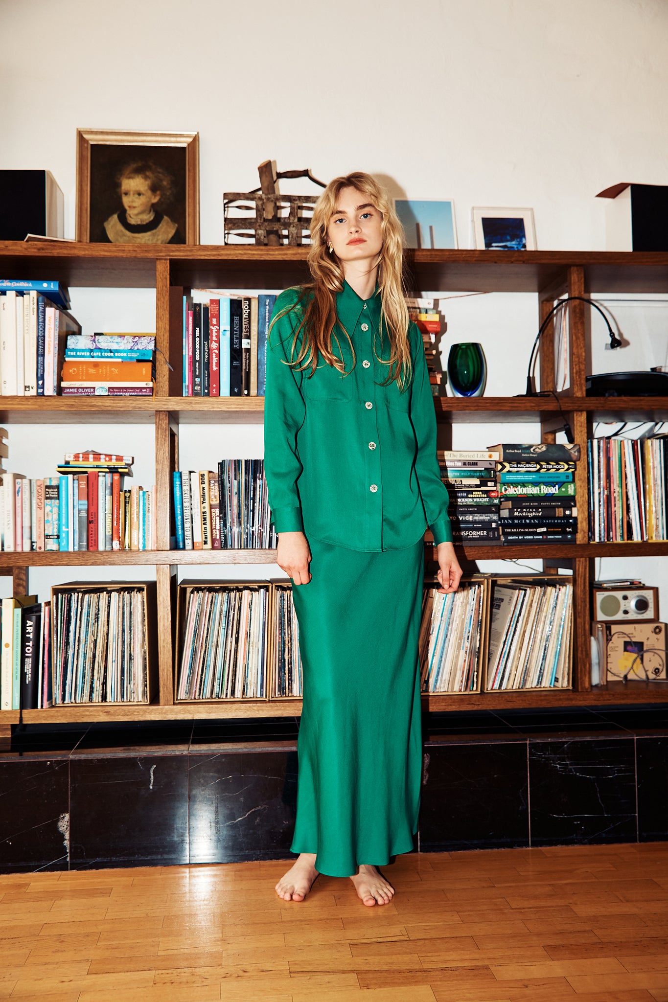 Model wearing green midi length skirt