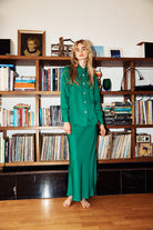 Model wearing green midi length skirt