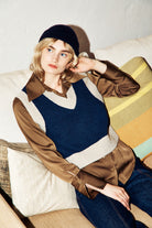 Woman wearing knitted vest in navy