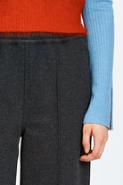Model wearing relaxed silhouette charcoal pant