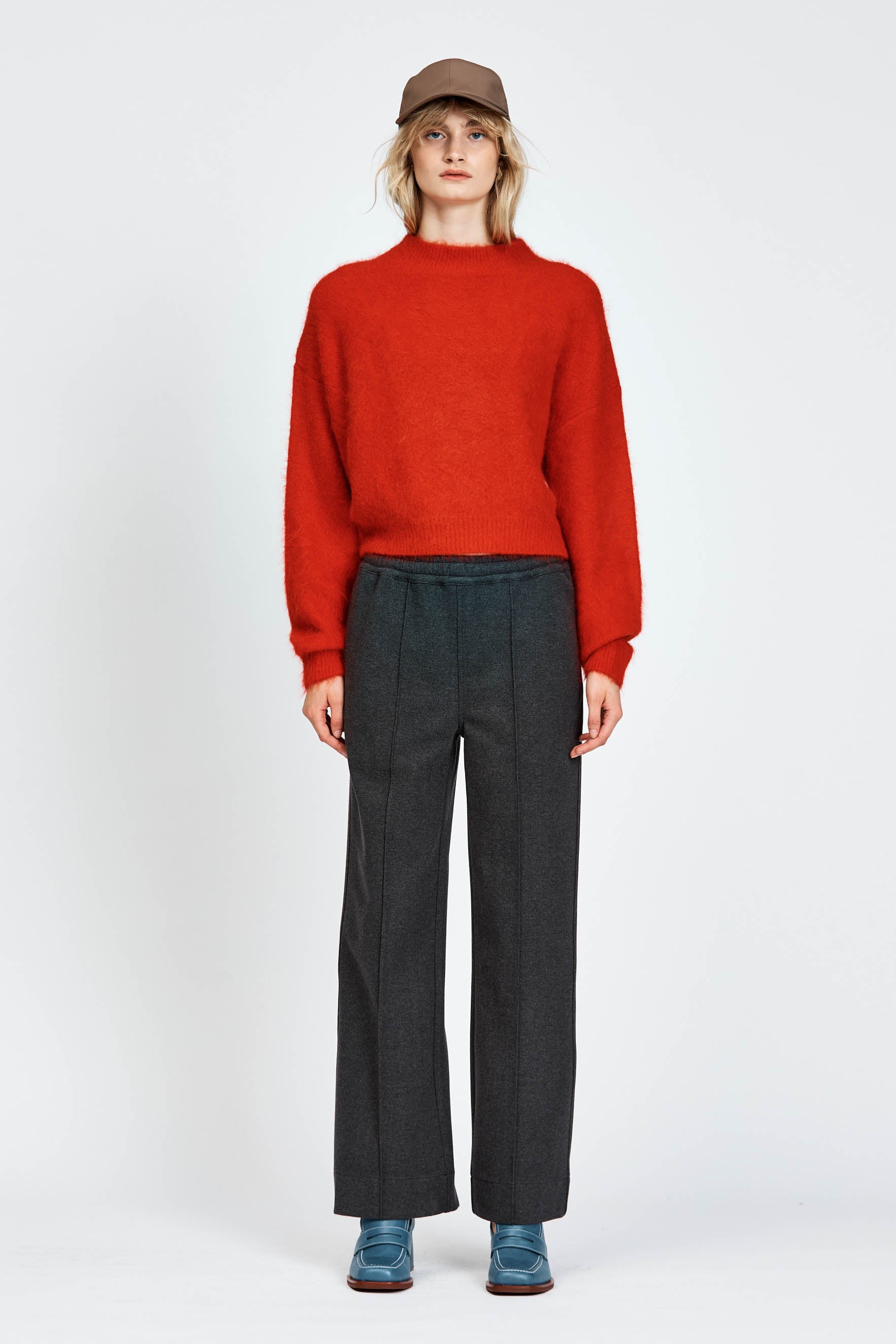 Woman wearing a red fluffy woollen jumper