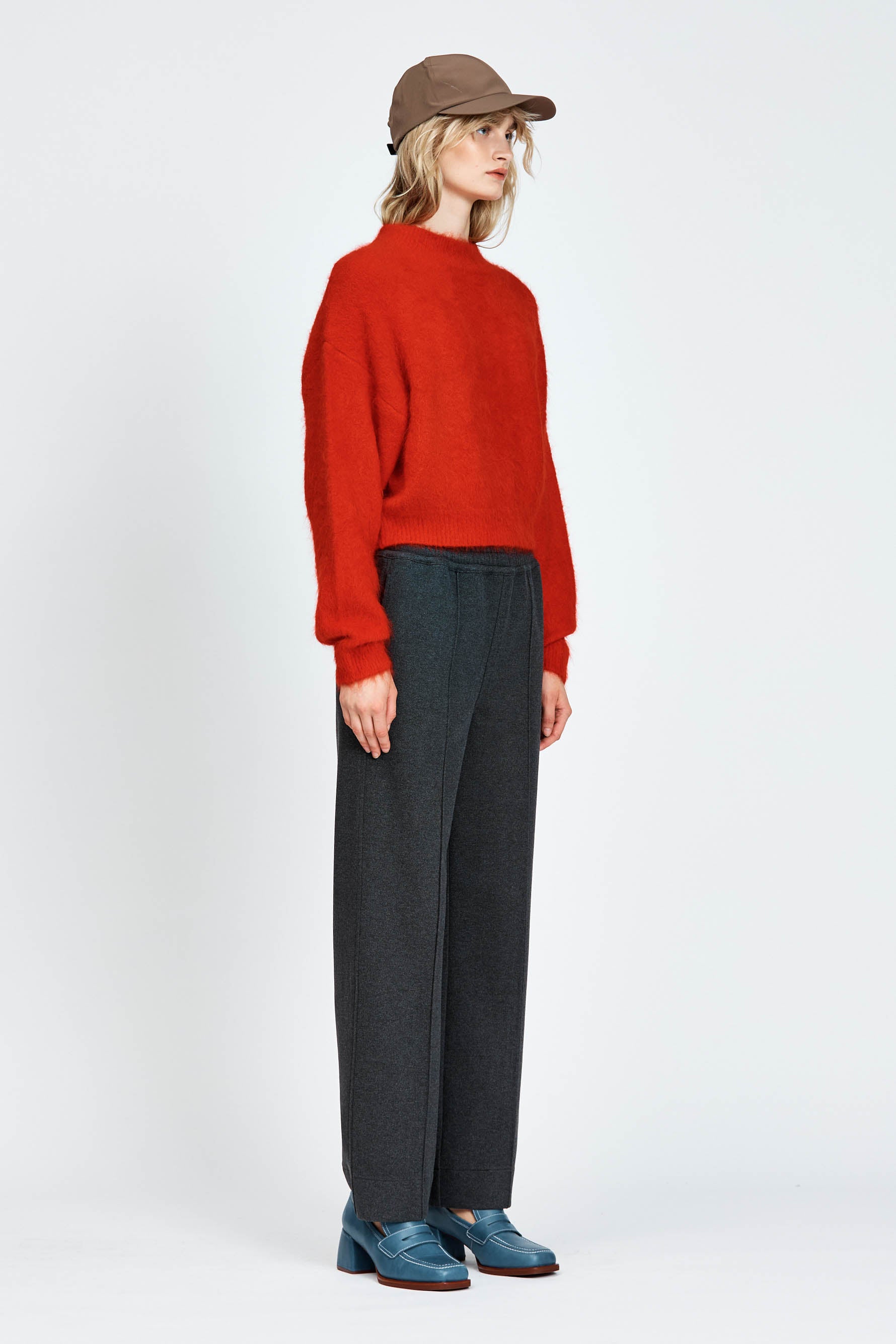 Woman wearing a red fluffy woollen jumper